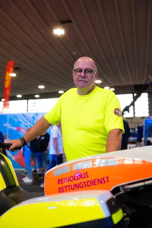 Man standing behind an ambulance motorcycle